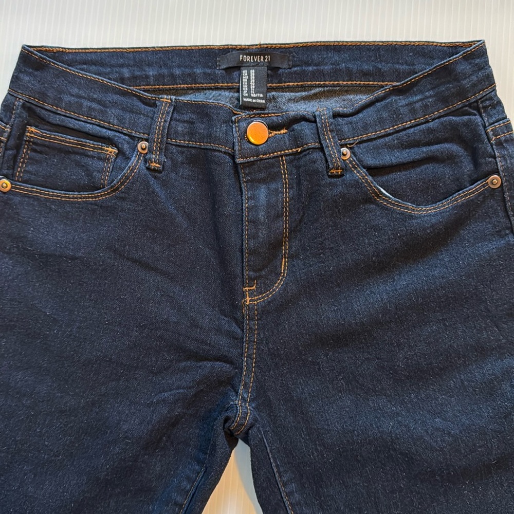 Forever 21 dark wash, light weight, five pocket skinny jeans. Size 28